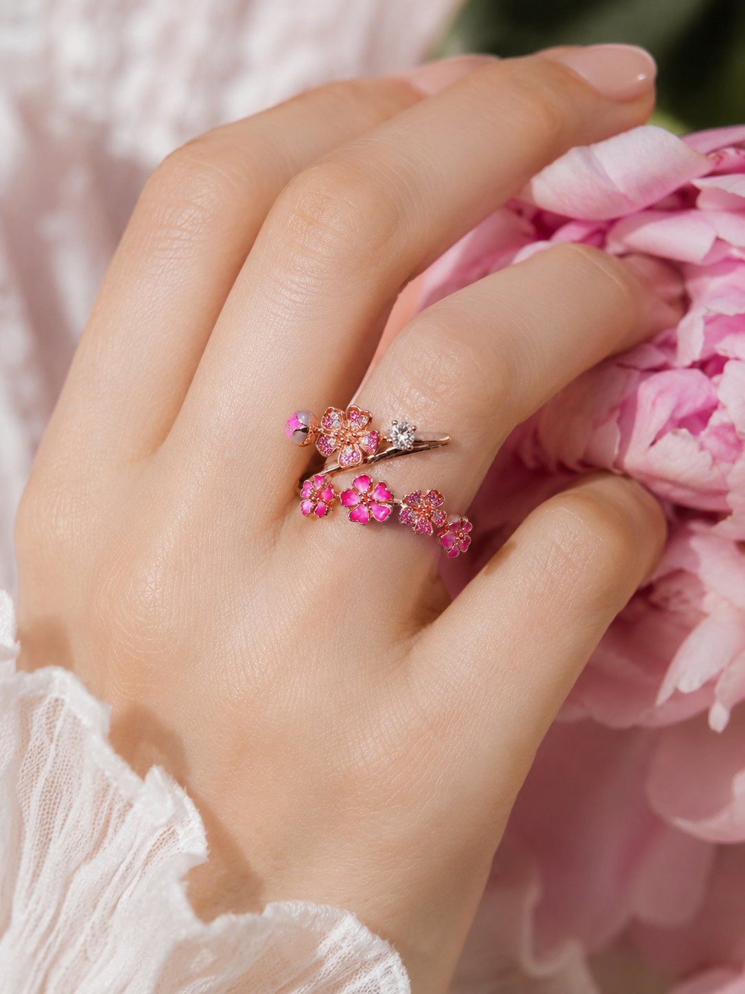 Peach blossom ring worn on hand