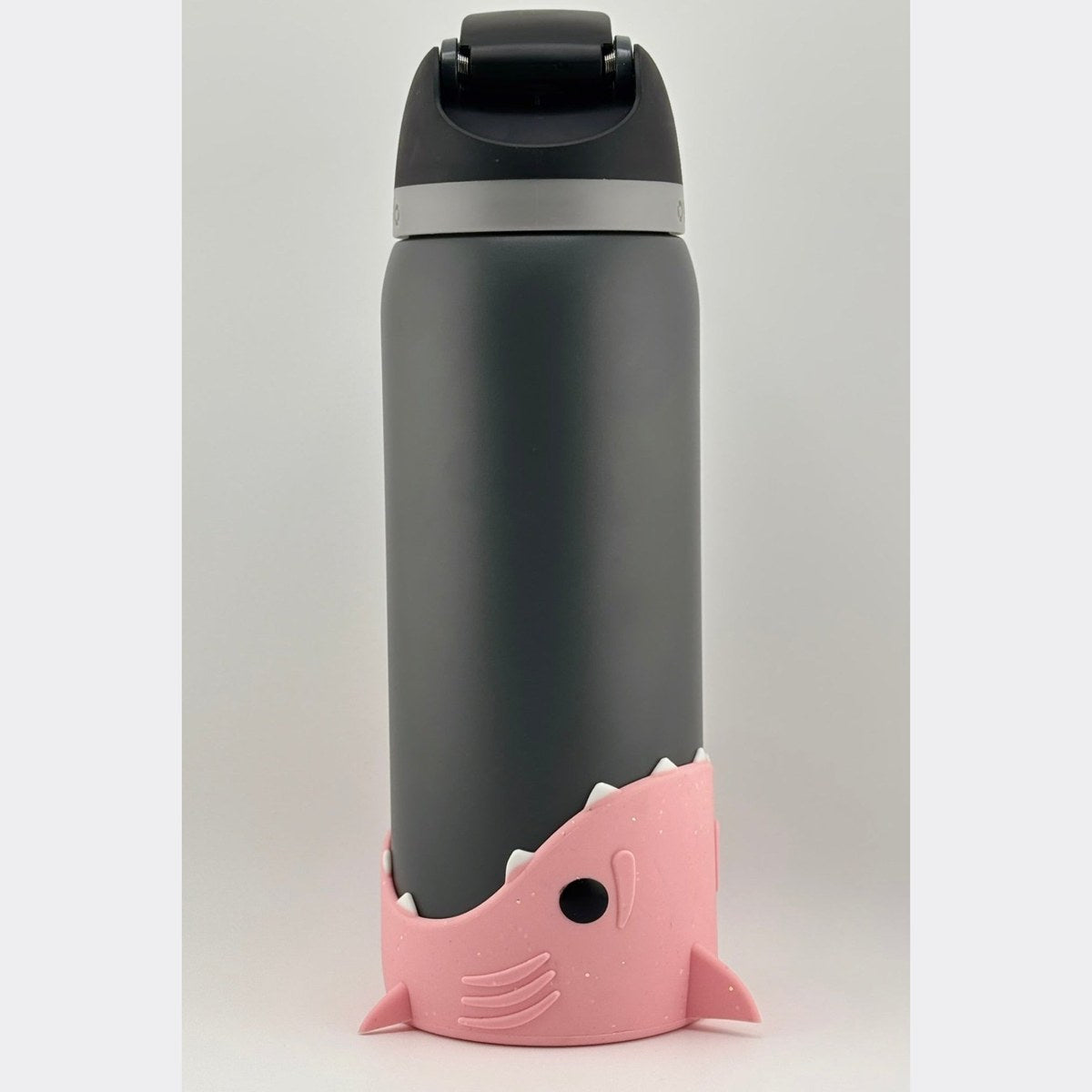 Shark bottle boot on the base of a water bottle